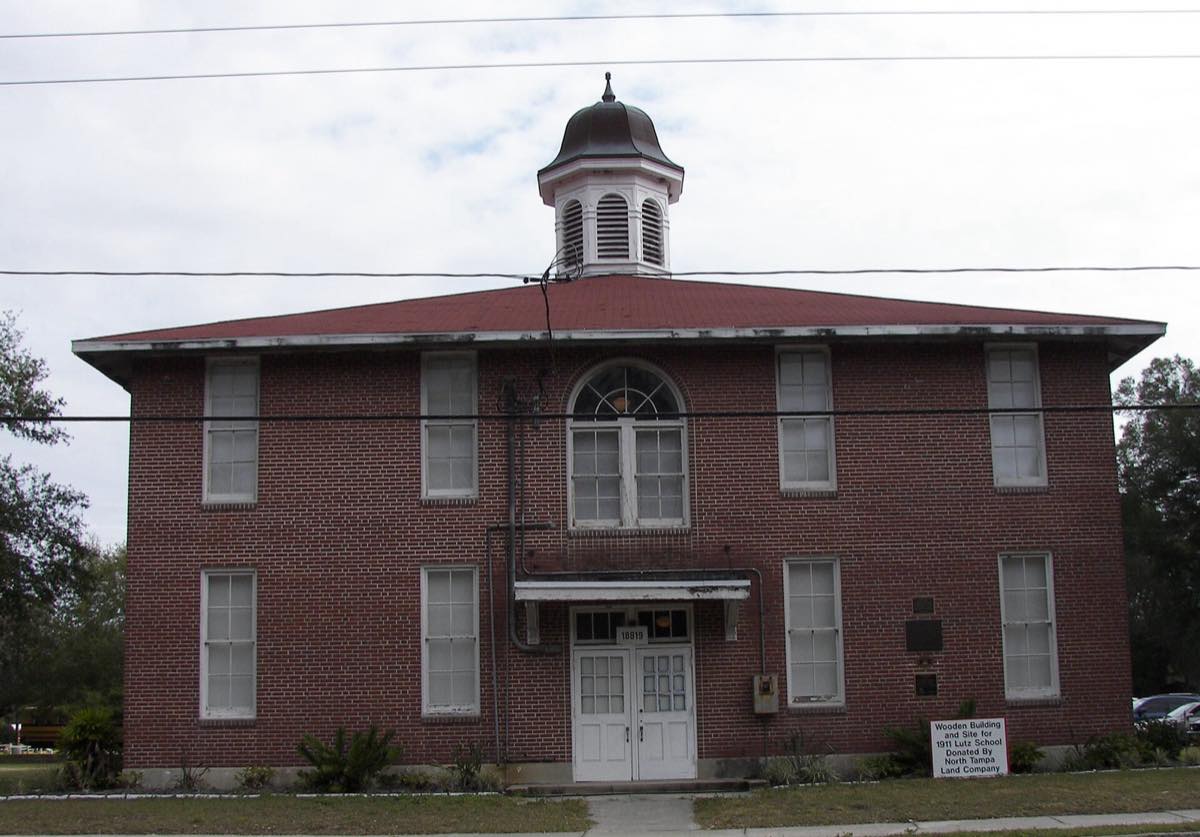 The historic brick Old Lutz Elementary School with its cupola