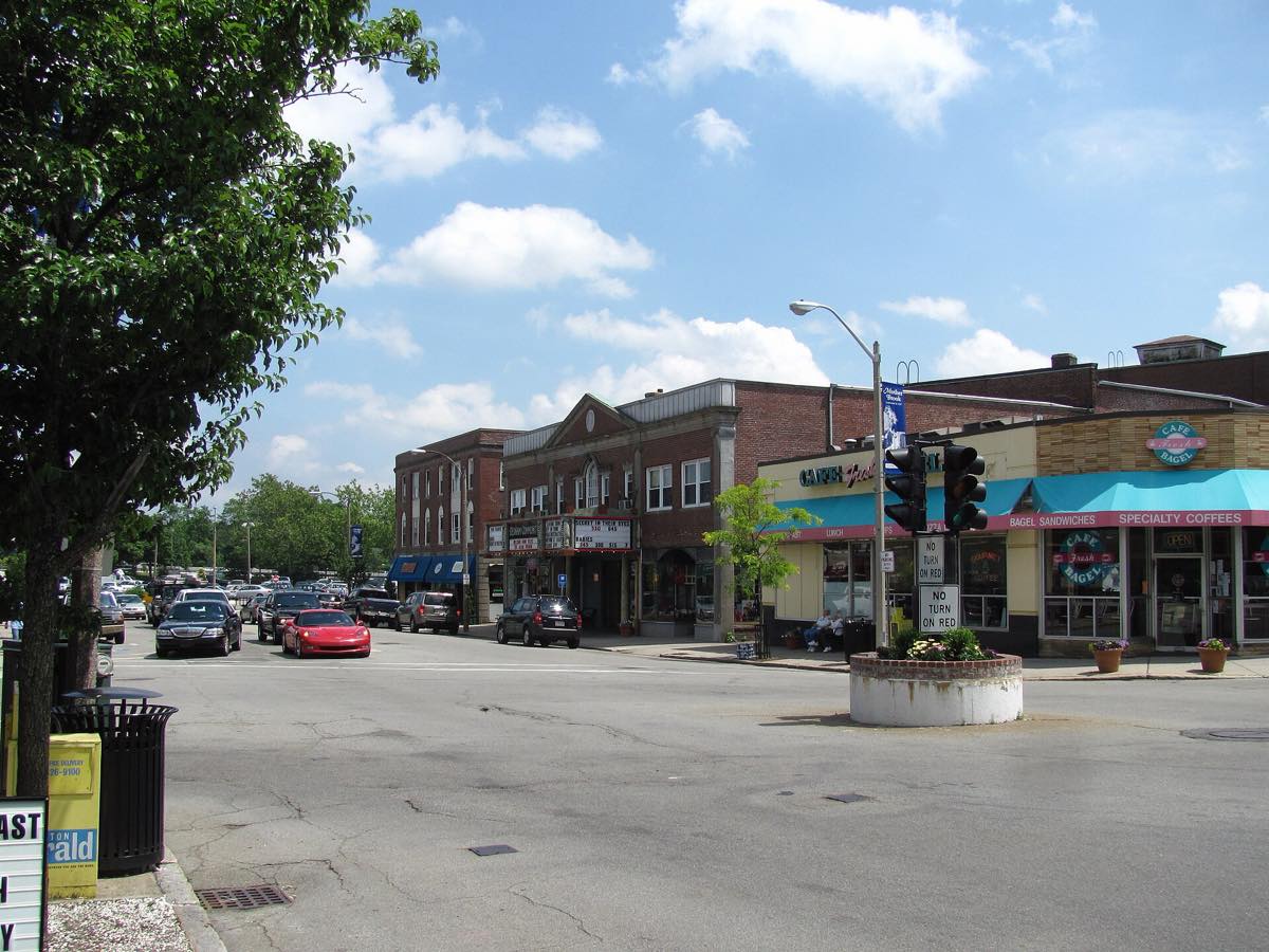 Dedham Square on High Street, brick storefronts and the intersection on a sunny day