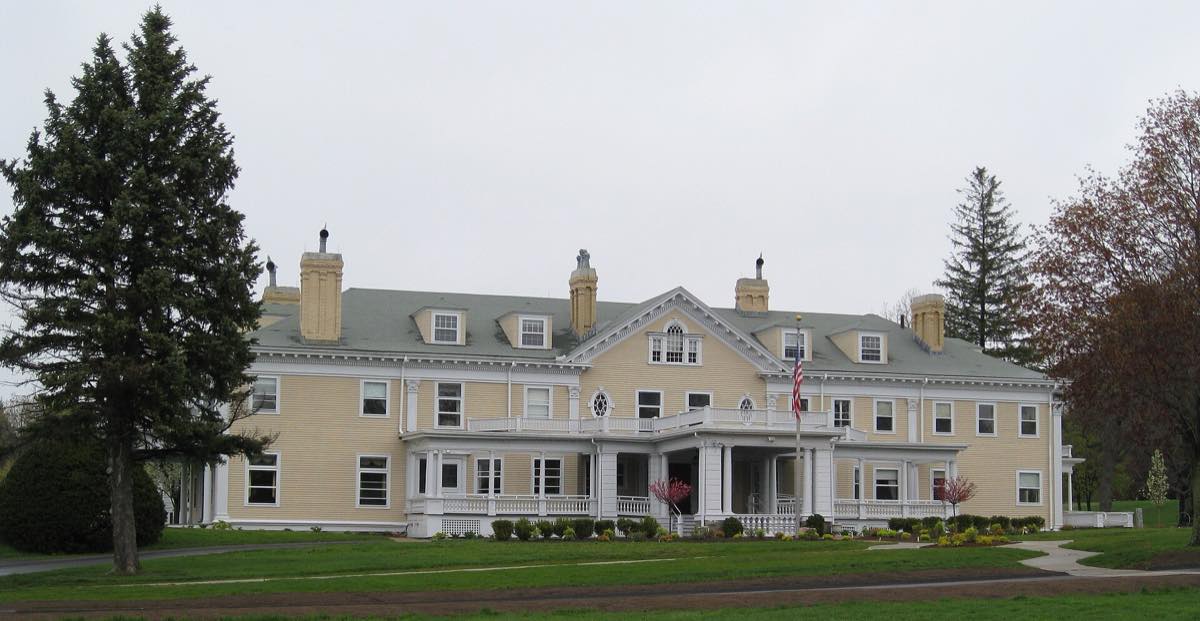 Endicott Estate, the yellow Colonial Revival mansion and front lawn on East Street