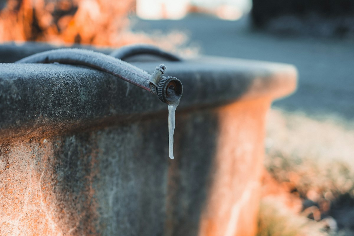 Icicles hanging from a frozen water spout
