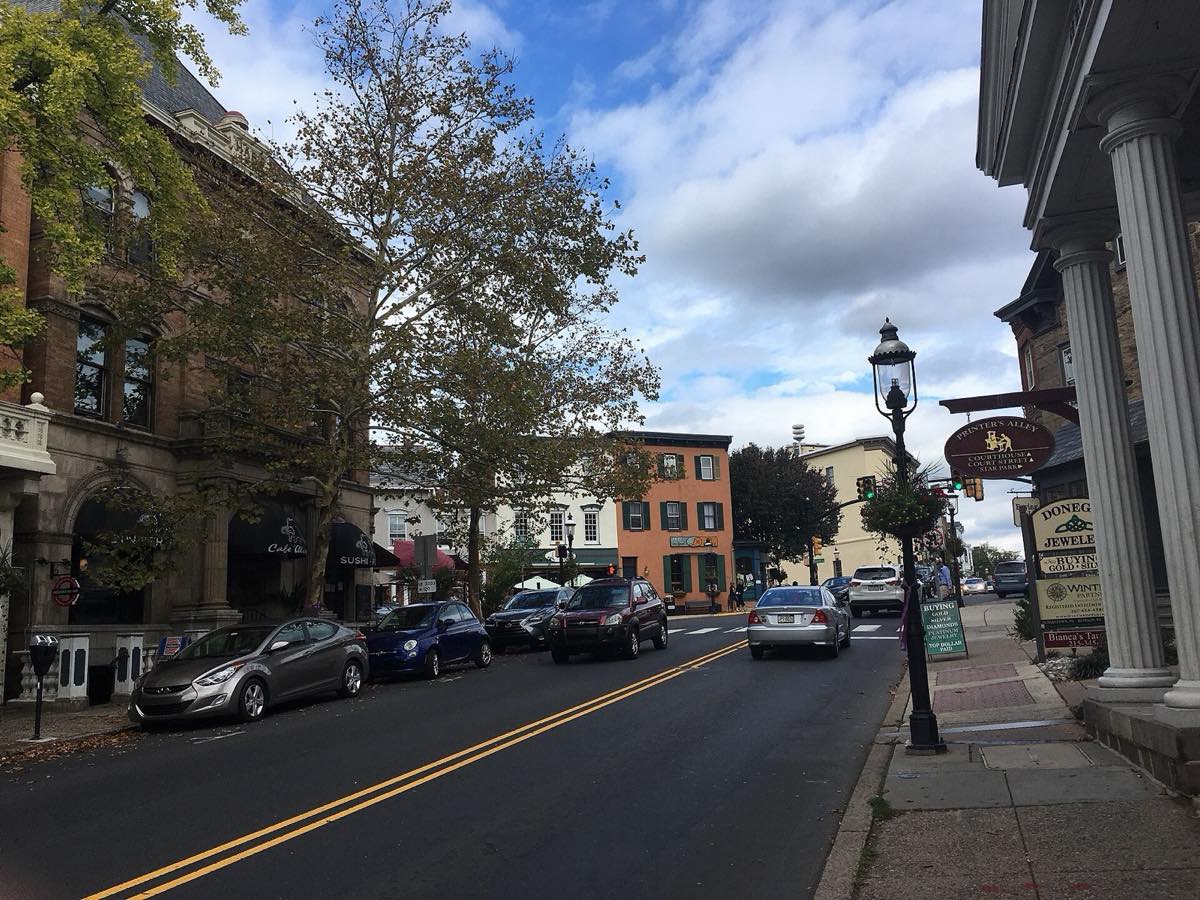 Main Street approaching Court Street in downtown Doylestown, lined with historic storefronts