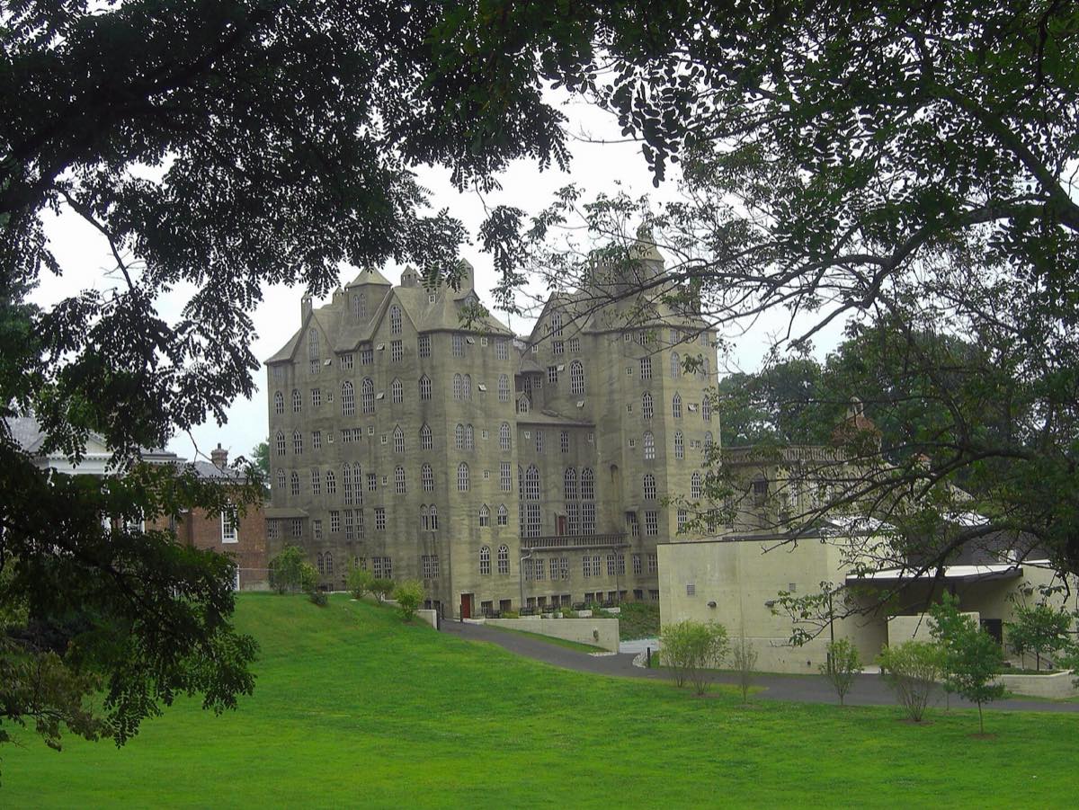 The Mercer Museum, a six-story concrete castle, framed by trees above a sloping lawn