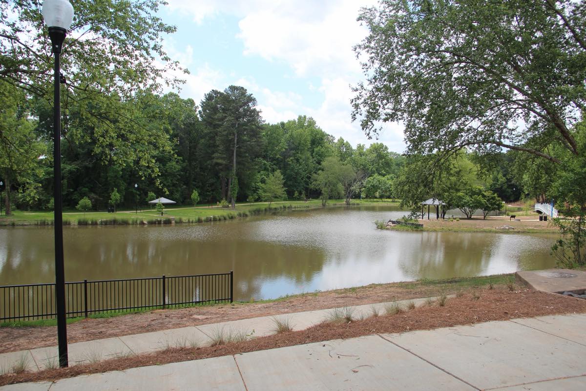 Pinnacle Park pond in Norcross ringed by trees and a gazebo